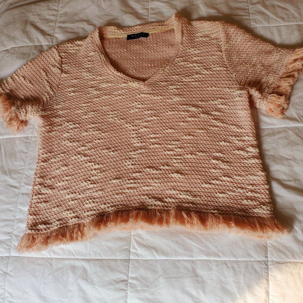 Maven West Sweater with fringe trim.